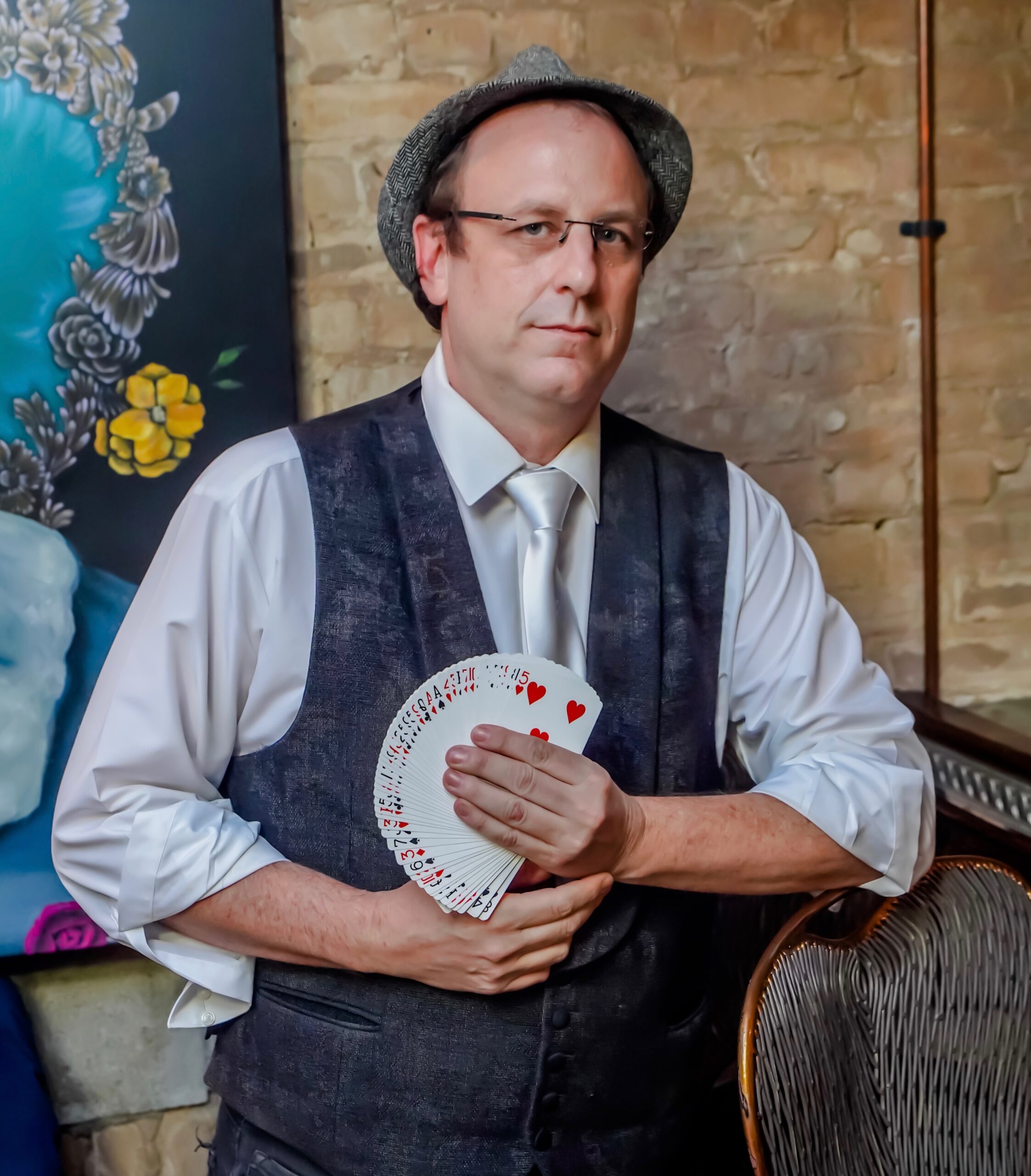 Eric the Magic Guy holding cards